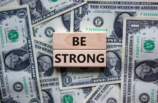 Strong Symbol Wooden Blocks Words Strong Beautiful Background Dollar Bills — Stock Photo, Image