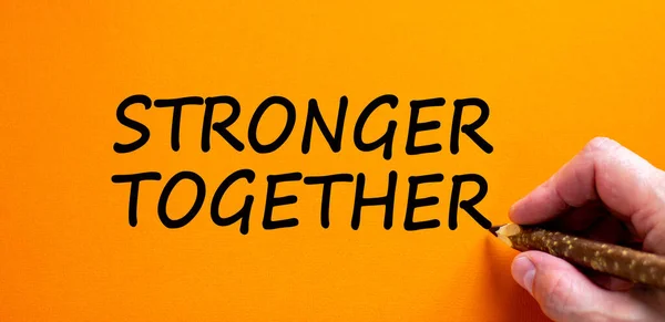 Stronger Together Symbol Businessman Writing Stronger Together Isolated Orange Background — Stock Fotó