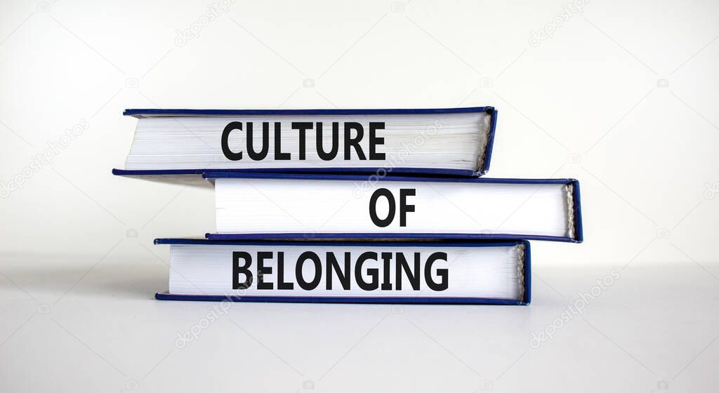 Culture of belonging symbol. Books with words 'culture of belonging' on beautiful white background. Business, culture of belonging concept. Copy space.