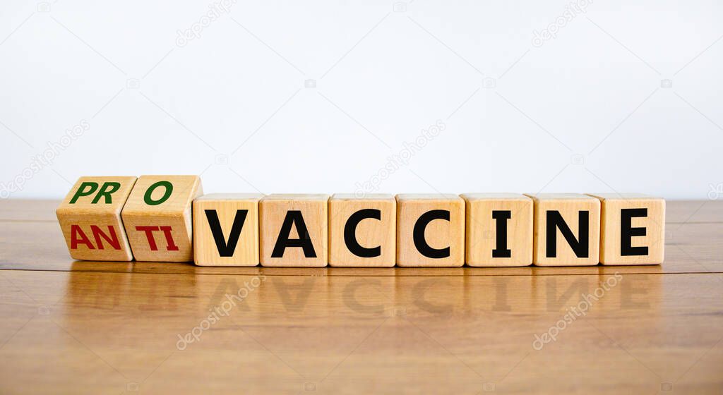 Pro-vaccine or anti-vaccine symbol. Turned a cube, changed words 'anti-vaccine' to 'pro-vaccine'. Beautiful white background. Copy space. Medical covid-19 pro-vaccine or anti-vaccine concept.