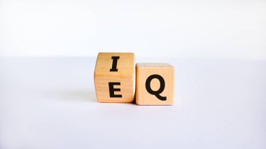 IQ or EQ symbol. Turned a cube, changed words IQ, intelligence quotient to EQ, emotional quotient. Beautiful white background. Concept of emotional and intelligence quotient. Copy space. clipart