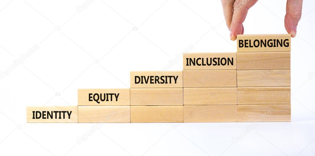 Equity, identity, diversity, inclusion, belonging symbol. Wooden blocks with words identity, equity, diversity, inclusion, belonging on white background. Inclusion, belonging, diversity concept.