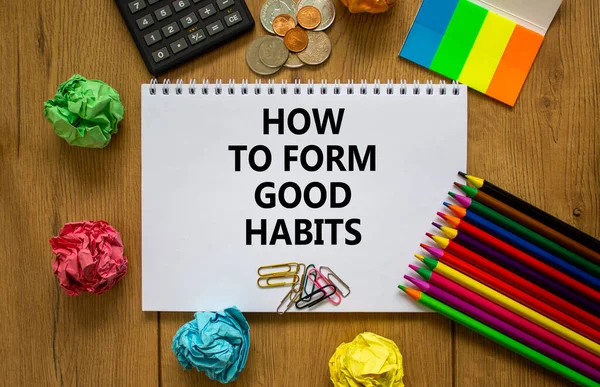 Good habits symbol. White note with words \'how to form good habits\' on beautiful wooden table, colored paper, colored pencils, paper clips, coins and calculator. Business and good habits concept.