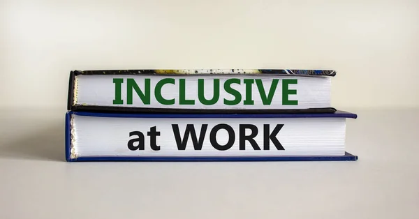 Inclusive at work symbol. Books with words \'Inclusive at work\' on beautiful white background. Business, inclusive at work concept. Copy space.