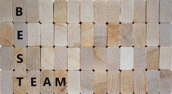 Best team symbol. Woden blocks with words \'best team\'. Beautiful wooden background. Business and best team concept. Copy space.