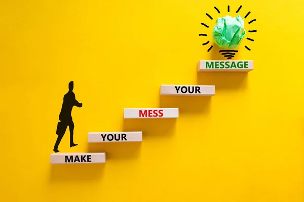 Business concept growth success process. Wood blocks stacking as step stair on yellow background, copy space. Businessman icon. Words 'make your mess your message'. Conceptual image of motivation.