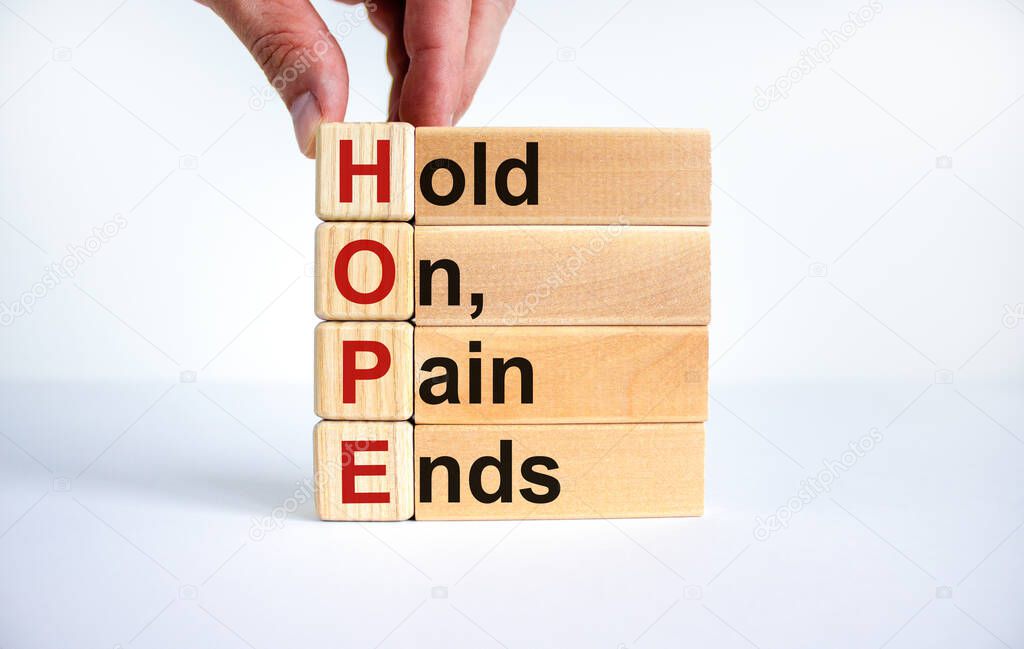 HOPE, hold on, pain ends symbol. Wooden cubes with words 'HOPE, hold on, pain ends. Beautiful white background, copy space. Business, motivational and HOPE, hold on, pain ends concept.