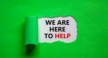 Destek sembolü. Yırtık yeşil kağıdın arkasında 