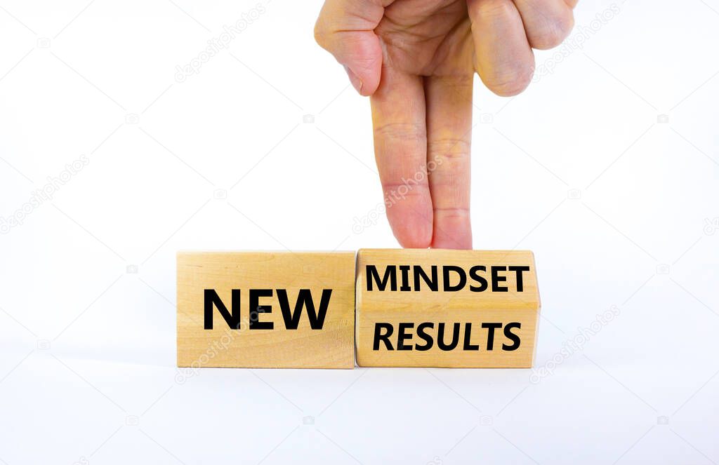 New mindset and results symbol. Businessman turns the wooden block and changes words 'new mindset' to 'new results'. Beautiful white background. Business, new mindset and results concept. Copy space.