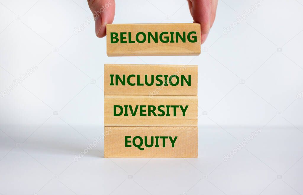 Equity, diversity, inclusion and belonging symbol. Wooden blocks with words 'equity, diversity, inclusion, belonging' on beautiful white background. Diversity, equity, inclusion and belonging concept.