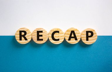 Recap symbol. Wooden circles with word 'recap' on beautiful white and blue background, copy space. Business and recap concept. clipart