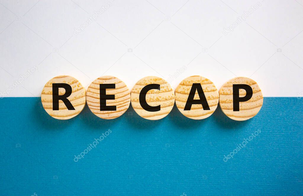 Recap symbol. Wooden circles with word 'recap' on beautiful white and blue background, copy space. Business and recap concept.