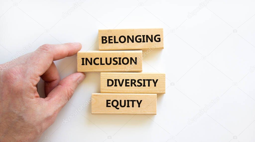 Equity, diversity, inclusion and belonging symbol. Wooden blocks with words 'equity, diversity, inclusion, belonging' on beautiful white background. Diversity, equity, inclusion and belonging concept.