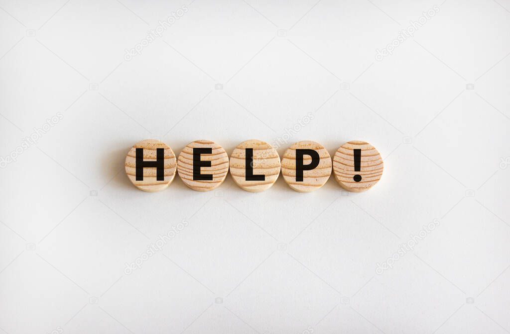 Support and help symbol. Wooden circles with the word 'help'. Business, psychology, support and help concept. Beautiful white background, copy space.