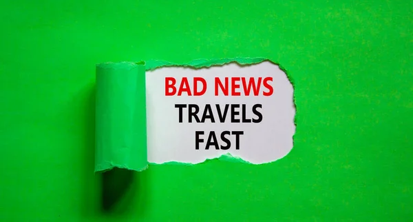 Bad news travels fast symbol. Words \'Bad news travels fast\' appearing behind torn green paper. Business and bad news travels fast quote concept. Copy space.
