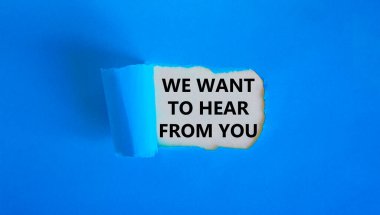 Support symbol. Concept words 'we want to hear from you' appearing behind torn blue paper. Beautiful blue background. Business and support concept. clipart