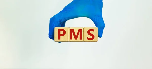 Medical Pms Premenstrual Syndrome Symbol Hand Blue Glove Holds Wooden — Stock Photo, Image