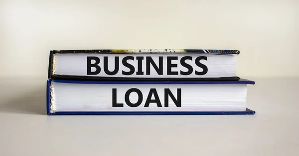 Time to business loan. Concept words 'business loan' on books on a beautiful white background. Business loan concept.