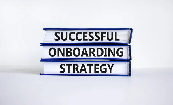 Successful onboarding strategy symbol. Books with words 'Successful onboarding strategy' on beautiful white background. Business and successful onboarding strategy concept. Copy space.