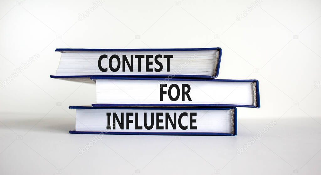Contest for influence symbol. Books with words 'Contest for influence'. Beautiful white background. Business, contest for influence concept, copy space.