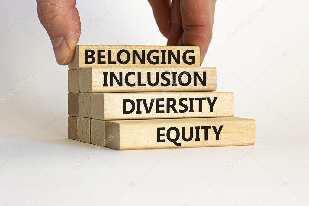 Equity, diversity, inclusion and belonging symbol. Wooden blocks with words 'equity, diversity, inclusion, belonging' on beautiful white background. Diversity, equity, inclusion and belonging concept.
