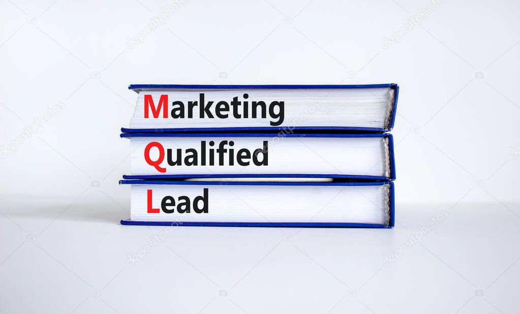 MQL marketing qualified lead symbol. Books with words 'MQL marketing qualified lead'. Beautiful white background. Business and MQL marketing qualified lead concept. Copy space.