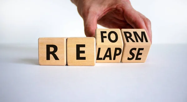 Relapse Reform Symbol Businessman Turns Cubes Changes Word Relapse Reform — Stock Photo, Image