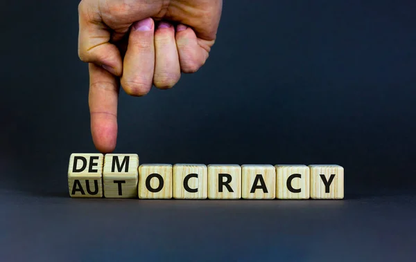 Democracy Autocracy Symbol Businessman Turns Wooden Cubes Changes Word Autocracy — 스톡 사진