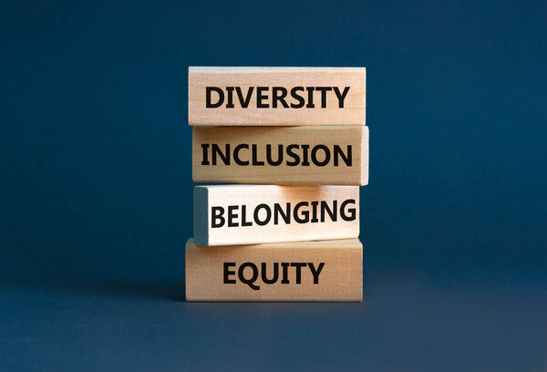 Equity, diversity, inclusion and belonging symbol. Wooden blocks with words 'equity, diversity, inclusion, belonging' on beautiful grey background. Diversity, equity, inclusion and belonging concept.