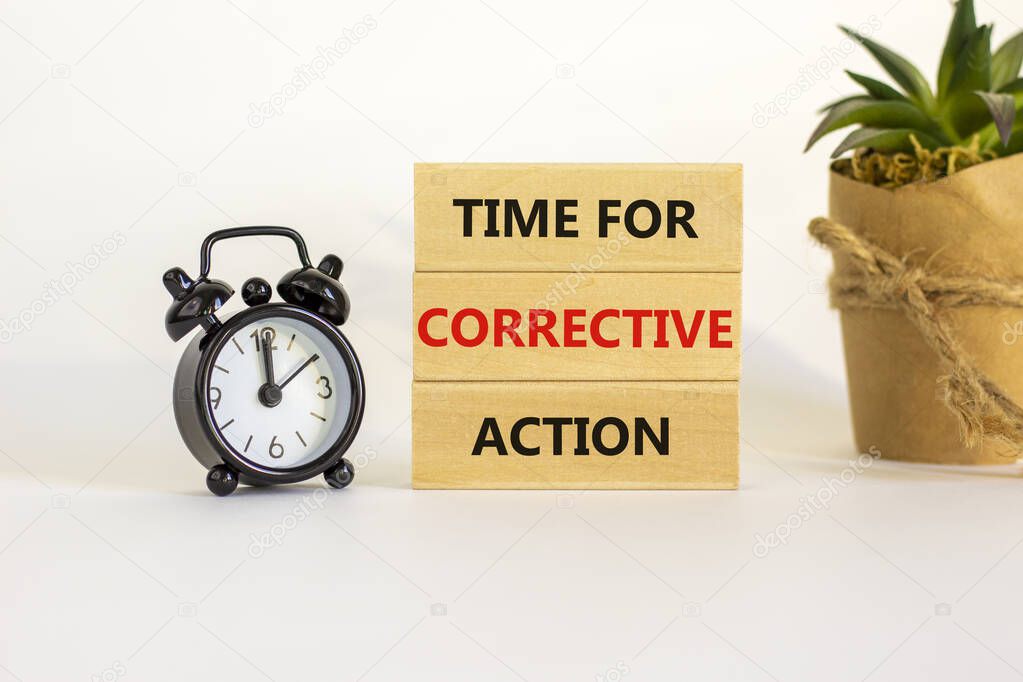 Time for corrective action symbol. Blocks with words time for corrective action. Black alarm clock, house plant. Beautiful white background. Copy space. Business, time for corrective action concept.