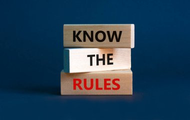 Know the rules symbol. Wooden blocks with words 'know the rules' on beautiful grey background. Business, know the rules concept. Copy space. clipart