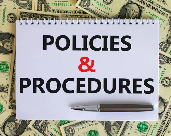Policies and procedures symbol. Words \'Policies and procedures\' on white note. Beautiful background from dollar bills, metallic pen. Business, policies and procedures concept. Copy space.