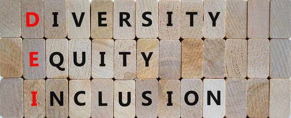 DEI, Diversity, equity, inclusion symbol. Wooden blocks with words DEI, diversity, equity, inclusion on beautiful wooden background. Business, DEI, diversity, equity, inclusion concept.