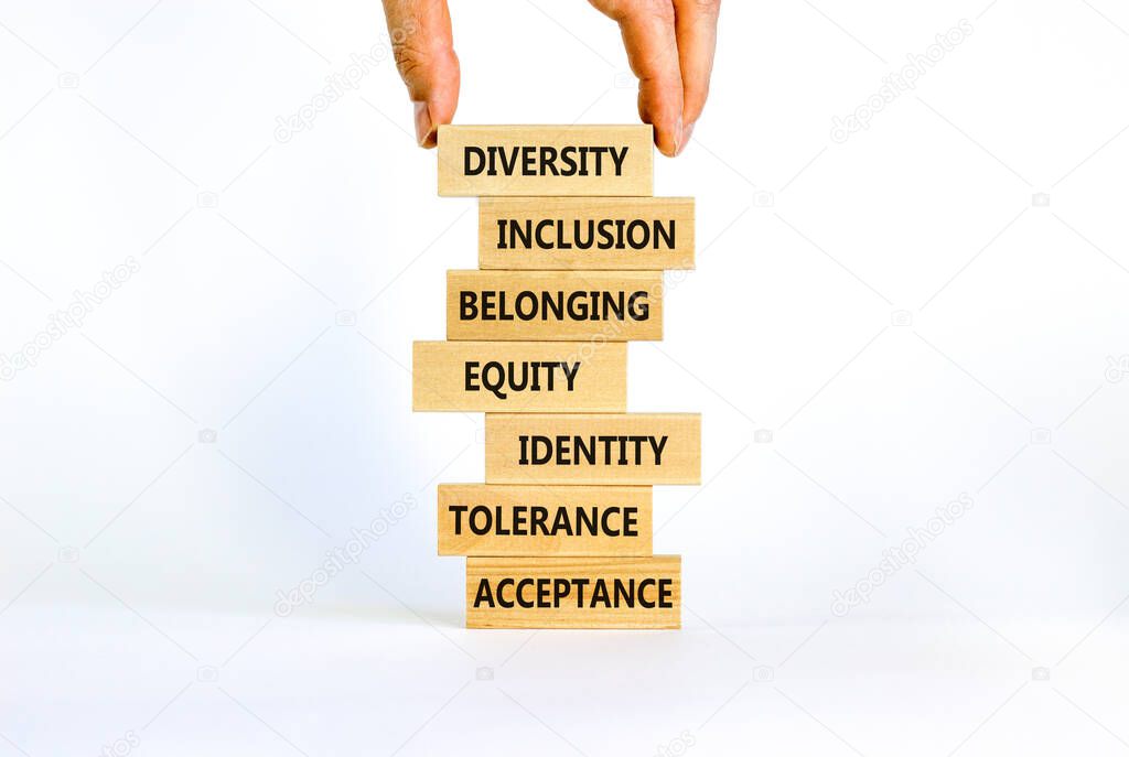 Diversity, inclusion symbol. Diversity belonging inclusion equity identity tolerance acceptance words written on wooden block. Beautiful white background. Diversity, inclusion and belonging concept.