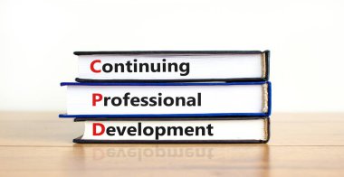 CPD, continuing professional development symbol. Books with words CPD, continuing professional development on beautiful white background. Business, CPD, continuing professional development concept. clipart