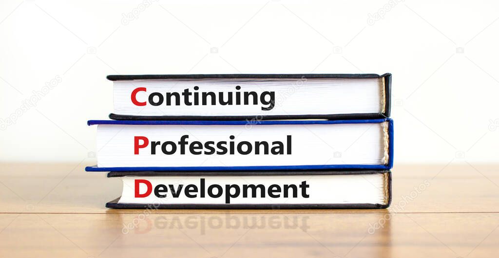 CPD, continuing professional development symbol. Books with words CPD, continuing professional development on beautiful white background. Business, CPD, continuing professional development concept.