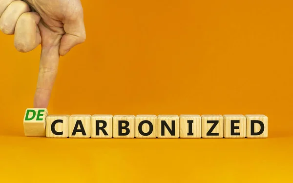 Carbonized Decarbonized Symbol Businessman Turns Wooden Cube Changes Words Carbonized — Stock Photo, Image