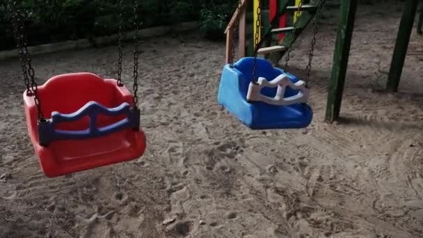Closeup View Empty Swing Set Moving Back Forth Children Deserted — 비디오