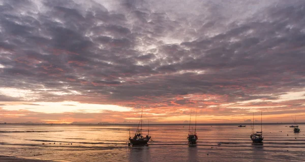 Silhouette of group of fishing boat on sea, seascape at sunrise, sky — Stock Photo, Image