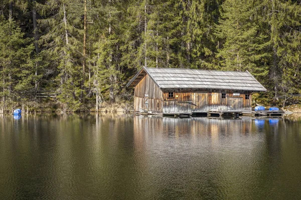 Wooden house on lake coast