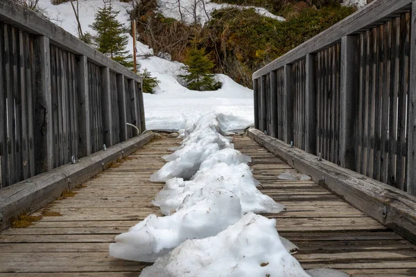 Snow on wooden bridge in mountanis