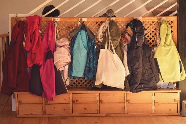 Wardrobe at the entrance of the nursery school with the coats hangin
