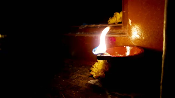 Beautiful view of Traditional hand made clay or Sand diya lamps lit during diwali celebration