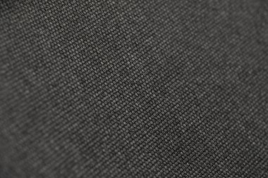 Güzel kumaşın kabataslak yüzeyinin soyut desen dokusu ve arkaplanının yakınlaştırılması