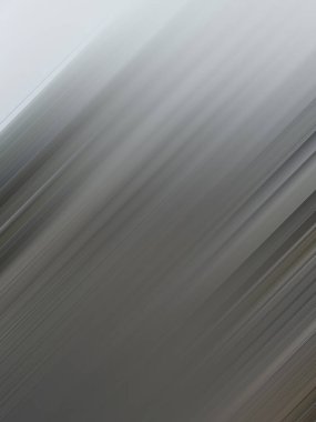 Hareketin yakın çekimi, beyaz ve gri renkli soyut arkaplanı bulanıklaştırdı