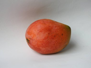 Closeup of beautiful fresh and colorful Indian Alphonso Mango fruits isolated on white background