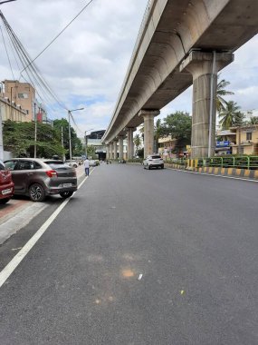 Bangalore, Karnataka, India-Jun 09 2021: Closeup of empty roads due to covid 19 lockdown rules restriction, for transport in a Bangalore, Yelachenahalli Metro Station Road looks beautiful and clean