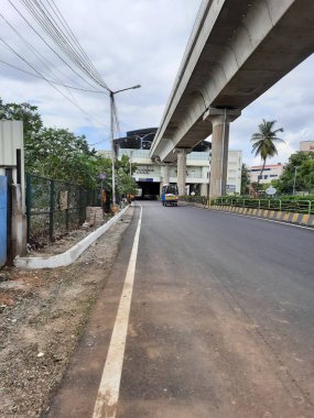 Bangalore, Karnataka, India-Jun 09 2021: Closeup of empty roads due to covid 19 lockdown rules restriction, for transport in a Bangalore, Yelachenahalli Metro Station Road looks beautiful and clean