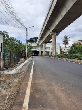 Bangalore, Karnataka, India-Jun 09 2021: Closeup of empty roads due to covid 19 lockdown rules restriction, for transport in a Bangalore, Yelachenahalli Metro Station Road looks beautiful and clean