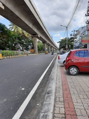 Bangalore, Karnataka, India-Jun 09 2021: Closeup of empty roads due to covid 19 lockdown rules restriction, for transport in a Bangalore, Yelachenahalli Metro Station Road looks beautiful and clean